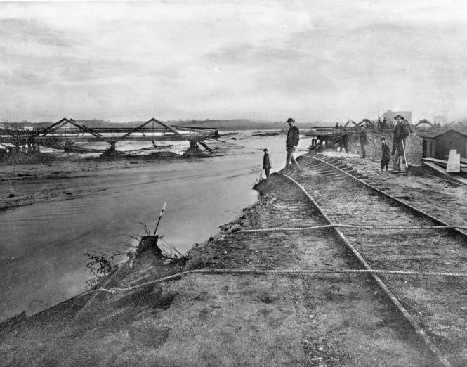 Flooding was common in the 1880s. Here, flood damage to the Santa Fe tracks on the old Downey Avenue Bridge (later North Broadway), 1885-1886