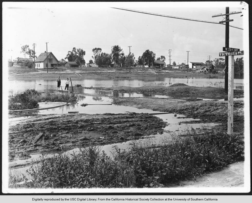 View of flooding near the intersection of 71st Street and Victoria Avenue in South Los Angeles, 1900
